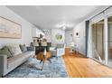 Bright living room with hardwood floors and access to patio at 857 S Van Gordon E104 Ct # E104, Lakewood, CO 80228