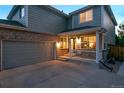 Charming two-story home with a covered porch, attached garage, and well-manicured lawn at 16829 Trail View Cir, Parker, CO 80134