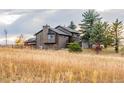 Charming two-story home surrounded by mature trees and a well-maintained yard at 2312 Arabian Trl, Elizabeth, CO 80107
