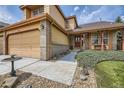 Welcoming home entrance with a well-kept lawn, a path to the front door, and a glimpse of the inviting interior at 9001 W Chatfield Dr, Littleton, CO 80128