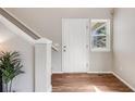 Bright entryway featuring wood floors, staircase and a decorative plant at 11223 Jansen St, Parker, CO 80134