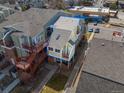 An aerial view of a charming townhome that highlights its position within a well-maintained and appealing residential area at 970 S Dawson Way # 15, Aurora, CO 80012