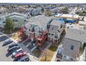 Aerial view of multi-Gathering building with patios, stairs, and parking lot at 970 S Dawson Way # 15, Aurora, CO 80012