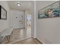 Bright foyer with tiled floors, white walls and an adjacent bedroom for easy access at 5238 Clearbrooke Ct, Castle Rock, CO 80104