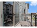 Cozy outdoor balcony with seating, offering a relaxing space to enjoy the fresh air and neighborhood views at 9072 E 47Th Ave, Denver, CO 80238