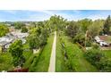 Scenic aerial view of the neighborhood walking trail, surrounded by lush greenery and mature trees at 10009 Dodge Dr, Northglenn, CO 80260