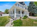 Charming two-story home with a inviting front porch, complemented by manicured landscaping at 5009 Mt Osage St, Frederick, CO 80504