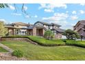 Charming home with a brick facade, landscaped yard, and an inviting entrance at 10114 Meade Ct, Westminster, CO 80031