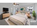 Comfortable bedroom featuring a ceiling fan, bright natural light and easy access to the ensuite at 381 Freestone St, Brighton, CO 80603