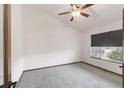 Neutral bedroom featuring gray carpet, window, and a ceiling fan at 1507 Alpine Ave, Berthoud, CO 80513