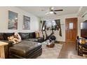 Comfortable living room with a leather sectional, perfect for relaxing and entertaining guests at 4820 W 13 Ave, Denver, CO 80204
