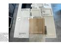 Design center selections, including cabinet styles, floor tile, and carpet samples at 11341 W Alder Dr, Littleton, CO 80127