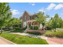 Attractive two-story home featuring a well-manicured lawn and inviting curb appeal at 8318 Devinney Ct, Arvada, CO 80005