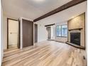 Open living room showcasing fireplace and hardwood floors at 2949 Shady Holw, Boulder, CO 80304