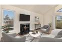 Living room with a fireplace, and plenty of natural light at 3549 S Fairplay Way # 10, Aurora, CO 80014