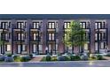 Charming apartments featuring balconies, lush landscaping, and modern architectural details at 1652 N Lafayette St # 2, Denver, CO 80218