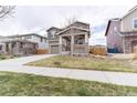 Charming two-story home with a covered porch and attached two-car garage at 5937 N Orleans St, Aurora, CO 80019