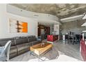 Open-concept living area with kitchen and city views at 891 14Th St # 2816, Denver, CO 80202