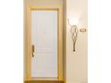 White door with brass hardware in a condo unit at 150 S Madison St # 112, Denver, CO 80209