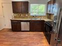 This lovely kitchen features wood cabinets and stainless steel appliances at 16753 E Ithaca Pl, Aurora, CO 80013