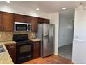 This lovely kitchen features stainless steel appliances and wood cabinets at 16753 E Ithaca Pl, Aurora, CO 80013