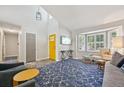Open-concept living room with ample natural light, modern decor, and hardwood floors at 6468 S Forest St, Centennial, CO 80121