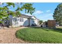 Private backyard with a patio area, ideal for entertaining and relaxation at 1801 Aspen St, Fort Lupton, CO 80621