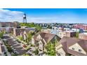 Beautiful aerial view of the neighborhood showcasing the well-maintained townhomes and a clear blue sky at 5444 Zephyr St # 203, Arvada, CO 80002