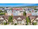 Community aerial view showcasing the layout of the townhomes in relation to surrounding buildings and amenities at 5444 Zephyr St # 203, Arvada, CO 80002