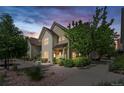 Charming two-story townhome with lush landscaping and inviting front entrance at 5444 Zephyr St # 203, Arvada, CO 80002