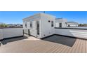 Enjoy outdoor living on this rooftop deck, offering a private escape with a small building for storage or relaxation at 888 S Valentia St # 101, Denver, CO 80247