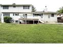 Large, grassy backyard with a deck, perfect for outdoor entertaining at 3262 S Salida Way, Aurora, CO 80013