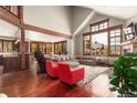 Bright living room with large windows, hardwood floors, and cozy furniture at 168 Corkscrew Dr, Breckenridge, CO 80424