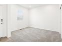 Neutral bedroom with carpet and a window letting in natural light at 6074 Hourglass Dr, Brighton, CO 80601