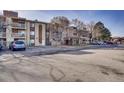 Apartment building with a parking lot and covered entrance at 1304 S Parker Rd # 359, Denver, CO 80231