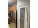 Stainless steel refrigerator and pantry with glass door, adding convenience and style at 10457 W Hampden Ave # 104, Lakewood, CO 80227