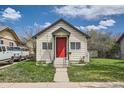 Quaint home with a red door, a small front yard, and sidewalk access at 1746 Galena St, Aurora, CO 80010