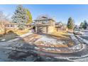 Two-story house with a driveway and landscaping at 7649 E Amherst Ave, Denver, CO 80231