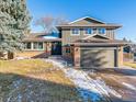 Two-story house with a large yard and attached garage at 7649 E Amherst Ave, Denver, CO 80231