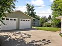 Spacious detached garage with two bays and extra parking space, plus shed in the yard at 4125 Pierce St, Wheat Ridge, CO 80033