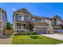 Charming two-story home with a well-maintained lawn and attached two-car garage, perfect curb appeal at 12631 Glencoe St, Thornton, CO 80241