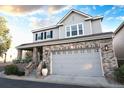 Beautiful two-story home with brick accents, a spacious two-car garage, and a welcoming covered entryway at 4545 S Monaco St # 328, Denver, CO 80237