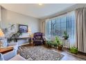 Cozy living room with hardwood floors, plants, and large windows, creating a relaxing atmosphere at 6268 Pike Ct # D, Arvada, CO 80403