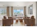 Cozy living room features bright natural light, comfortable seating, and contemporary decor at 101 Granby Way # B, Aurora, CO 80011