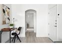 Bright hallway with neutral decor and attractive arched doorway leading to the bedroom at 5763 N Gibralter Way # 2-108, Aurora, CO 80019