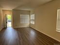 Bright living room features modern floors, large windows, and an open doorway at 20861 E 40Th Ave, Denver, CO 80249