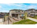 Two-story home with beautiful landscaping, brick accents, and a spacious driveway, set in a Gathering-friendly neighborhood at 4145 Manorbrier Cir, Castle Rock, CO 80104