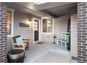 Inviting front porch with seating, a 'Welcome' sign, and charming decorative elements at 4145 Manorbrier Cir, Castle Rock, CO 80104