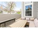 A furnished outdoor patio space including a table, seating, and view of the neighborhood at 6858 Zenobia St # 9, Westminster, CO 80030