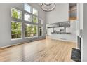 Bright living room with large windows, hardwood floors, fireplace and an open floor plan at 1795 Eldorado Cir, Superior, CO 80027